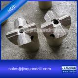Cross bits for rock drilling